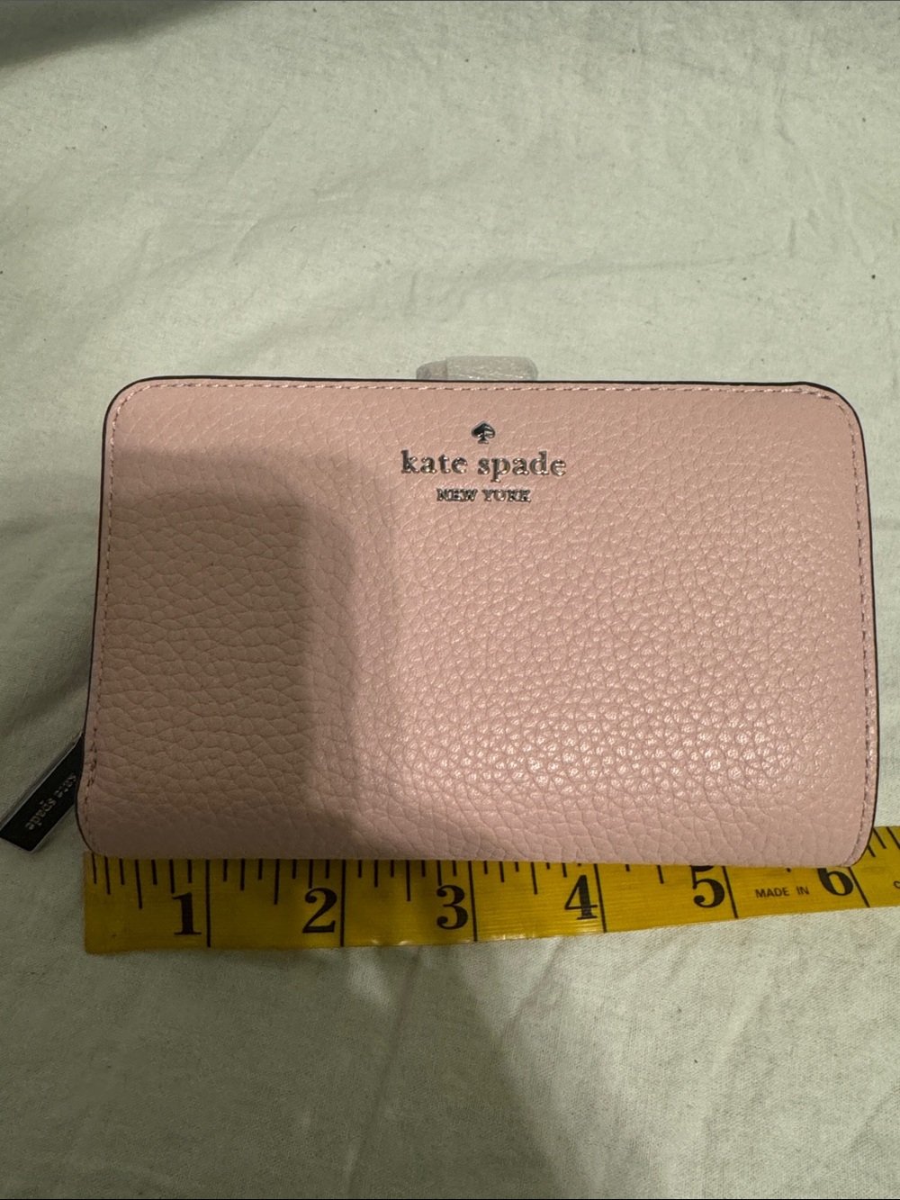 kate spade soft pink pebbled leather zip wallet